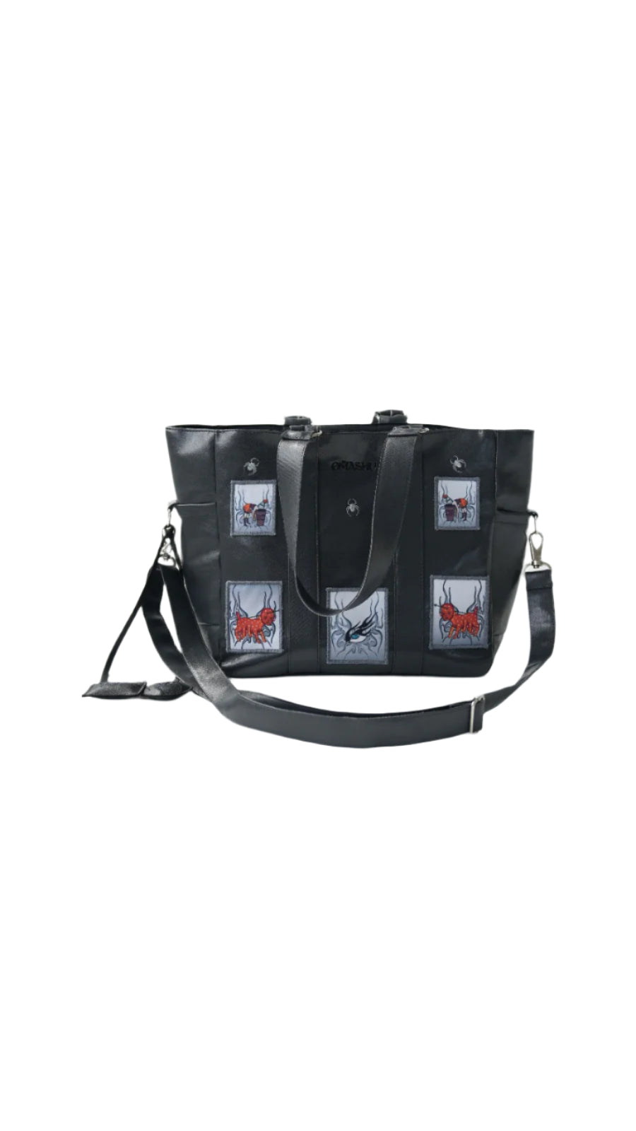 Omashu black tote bag with embroidered patches, laptop divider, and adjustable strap, showcasing bold streetwear accessory.