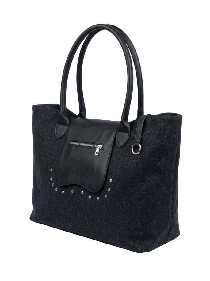 A black textured felt tote bag with smooth black leather handles, a front zippered pocket, and silver-tone studs, shown on a light gray background.
