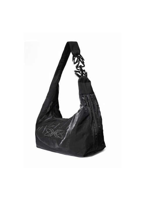 Black handbag with chain detail on a white background