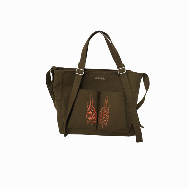 Brown bag with red dragon design on a white background