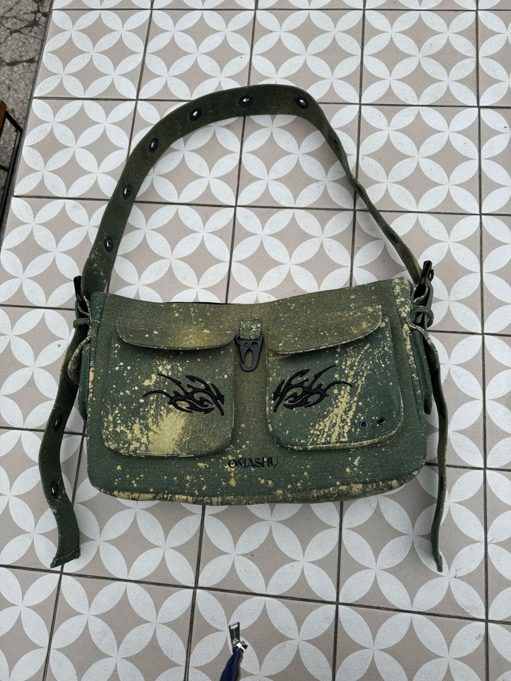 green bag on tiles
