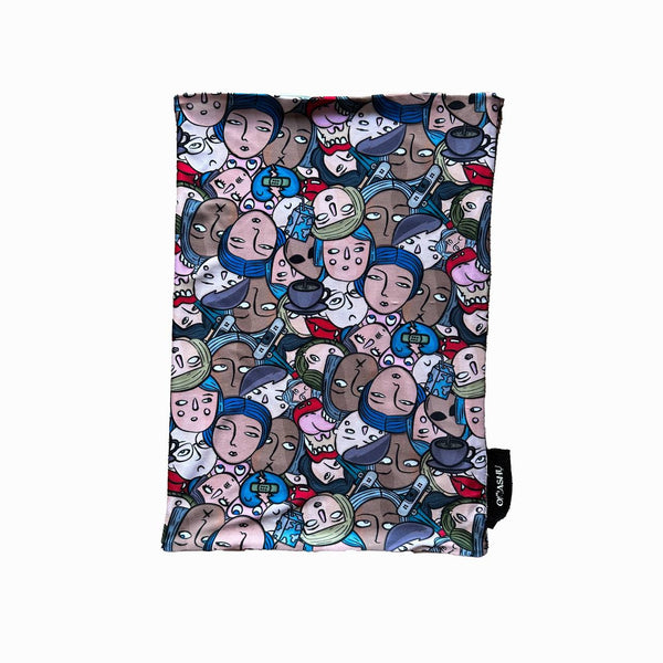 A rectangular piece of fabric with an abstract design featuring overlapping cartoon faces in various colors and expressions. The pattern is filled with busy details, showcasing a mix of emotions and character styles.