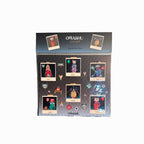 a sticker pack titled "OMASHU Polaroids - dogs and cats edition," featuring several cartoon-style Polaroid images of animals. Each Polaroid frame has a different dog or cat character with names like "Kittie," "Dodo," "Toby," "Mochi," "Jiyah," and "Totn." The characters are adorned with various accessories, including balloons, flowers, and other small whimsical elements like bugs and icons around them. The color scheme is vibrant, and the layout presents each character in a creative, artistic style with in